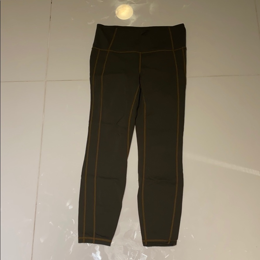 Athleta dark green salutation leggings size medium